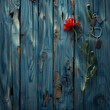 Red poppy and dog tags on blue wood  a Memorial Day remembrance.