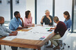 © peopleimages.com - Business people, architecture and discussion in meeting with blueprint for building design, brainstorming or planning. Architect, employee or collaboration with floor plan in boardroom with diversity