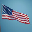 Waving American flag on a tranquil blue background, honoring Memorial Day.