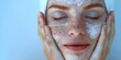 Person gently exfoliating skin with scrub for smooth radiant complexion. Concept Skin Care, Exfoliation, Beauty Routine, Radiant Complexion, Smooth Skin