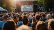 © Attasit - Crowds of supporters filling a town square, eagerly watching the big screen with excitement and anticipation during a public viewing event.