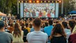© Attasit - Crowds of supporters filling a town square, eagerly watching the big screen with excitement and anticipation during a public viewing event.