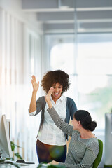 Computer, collaboration and high five for success with business people in office for bonus or support. Deal, smile and winner with employee team in workplace for celebration of goals or target