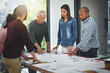 © peopleimages.com - Business people, architect and discussion in meeting with blueprint for building project, brainstorming or diversity. Architecture, employees or collaboration with paperwork in boardroom for proposal