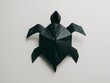 Black Origami Turtle on White Background, Symbolizing Creativity and Patience.