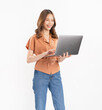 Cheerful beautiful Asian woman using laptop and looking forward on white background.