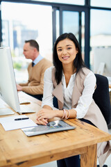 Canvas Print - Portrait, businesswoman and smile in office at desk with computer and Asian HR manager for corporate. Human resources, company and professional in coworking space, confident and resume for interview