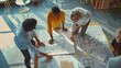© Generative AI - Creative people looking at project plan laid out on floor Mixed race business associates discussing new project plan in modern office : Generative AI