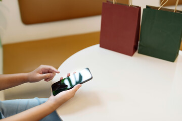 Poster - Hands of woman using mobile phone for online shopping