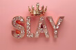 glamorous rose gold SLAY lettering with a golden crown, pink background 