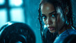 © vidkit - a determined woman lifting weights in the gym