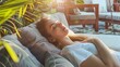 © Generative AI - Home lifestyle woman relaxing sleeping on sofa on outdoor patio living room Happy lady lying down on comfortable pillows taking a nap for wellness and health Tropical vacation : Generative AI