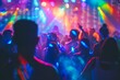 © Mrzproducer - crowd of people are dancing at a silent disco with colorful lights in the background.