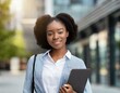 © Arthur - attractive smiling black woman office worker posing on city street and looking at camera