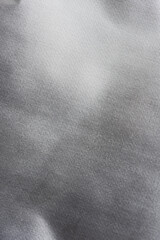 Silver background of aluminum foil. Grey ribbed background.