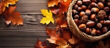 A Copy Space Image Of A Wicker Basket Filled With Chestnuts Is Seen From An Elevated Viewpoint This Autumn Scene Includes Vibrant Maple Leaves And A Dark Wood Card Arranged On A White Table
