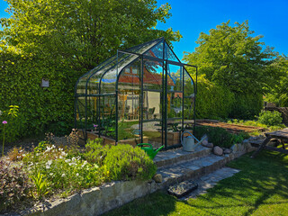 Wall Mural - greenhouse or glasshouse with flowers in the garden