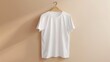 Blank white t-shirt mockup on a hanger against a neutral background