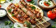Close-up of perfectly grilled Turkish kebabs, skewered with tender lamb and vibrant vegetables, on pita bread, served with tomatoes and sour cream on dark background