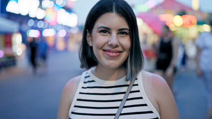 Wall Mural - Young beautiful hispanic woman smiling confident standing at Prater Vienna