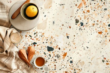 A table with a bowl of fruit and a cup of tea