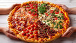 top-down view of a large, round pizza with a variety of toppings on each slice. It’s placed on a white wooden surface, and there are hands reaching towards the pizza