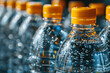 Close-up of plastic bottles of mineral water on a production line