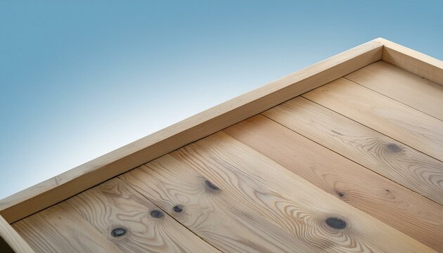 Top-down view of an isolated corner of an empty wooden table, with a clipping path. 