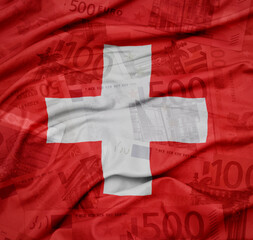 waving colorful national flag of switzerland on a euro money banknotes background. finance concept.