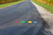 Directional arrows painted on road for cycling race. Bicycle riding, cycling competition and recreational sports concept.