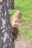 Fototapeta  - Adorable baby girl in Soviet military uniform