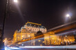The historic building of the National Theatre in Prague and traffic on the busy street in downtown. Public Transportation Night Lights Tram Motion, light trails. Long Exposure photo