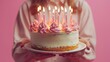 Celebration Cake: Birthday Delight with Candles and Pink Decorations