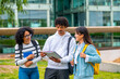 © unai - Multi-ethnic students reading notes before an exam in the university