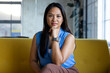© Wavebreak Media - At office, biracial businesswoman wearing blue top, sitting and looking thoughtful