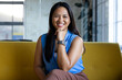 © Wavebreak Media - At office, biracial businesswoman wearing blue top, smiling at camera