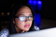 © Wavebreak Media - Biracial businesswoman in glasses works late, focusing on computer screen at office
