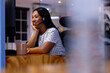 © Wavebreak Media - At office, biracial businesswoman wearing headset, working late