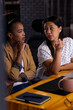 © Wavebreak Media - Diverse female colleagues discussing at night, working late
