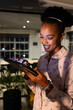 © Wavebreak Media - At office, African American businesswoman checking tablet, working late