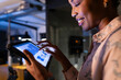 © Wavebreak Media - African American businesswoman reviews data on tablet at office, working late