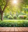 © Fantasy24 - Wooden table top on blur background of green garden with bokeh sunlight. High quality photo