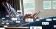 © vectorfusionart - Image of social media icons floating over mid section of a woman using digital tablet at home
