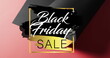 Image of black friday sale text over rolled up black paper on red background