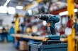 © Lucija - closeup of power drill on toolbox in blurred auto repair shop selective focus photography
