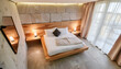 Bedroom room, marble wall, chic.interior of a luxurious country house with a modern design wood wall and led light, cool furniture thanks you