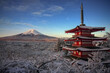 Red Japanese Torii pole, Fuji mountain and snow nature landscape background in winter season at Chureito pagoda, Japan
