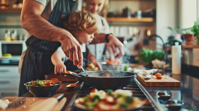 Dad and child cooking together in a modern kitchen, focus on hands preparing food