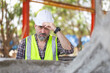 © JU.STOCKER - Portrait of Senior engineer man at the construction site, Caucasian man in hardhat at the precast factory site
