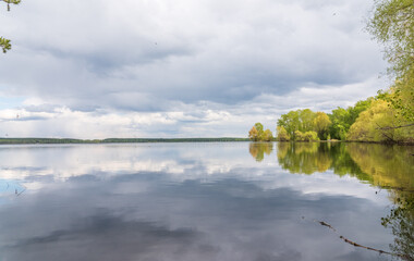 Wall Mural - Blue lake with cloudy sky, natural background